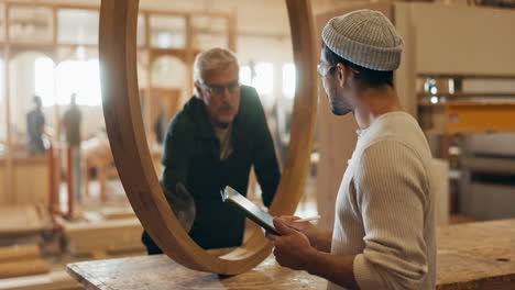 woodworkers inspecting wooden structure