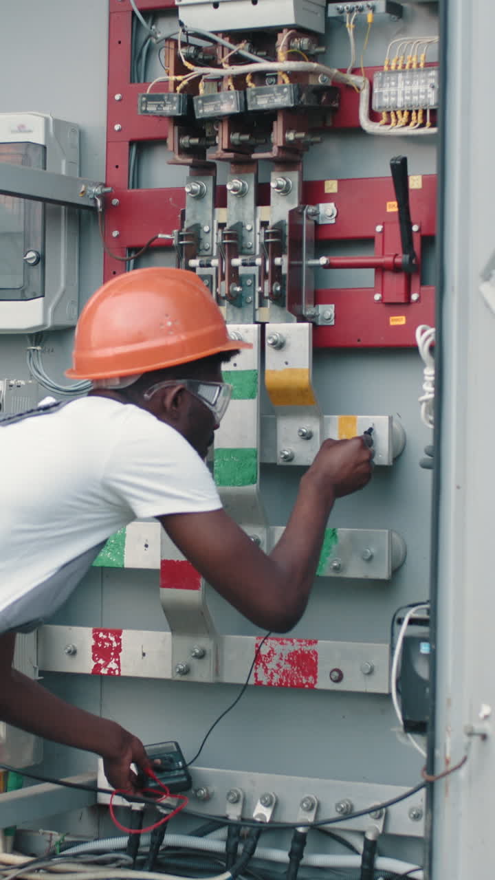 Electrician inspecting electrical panel