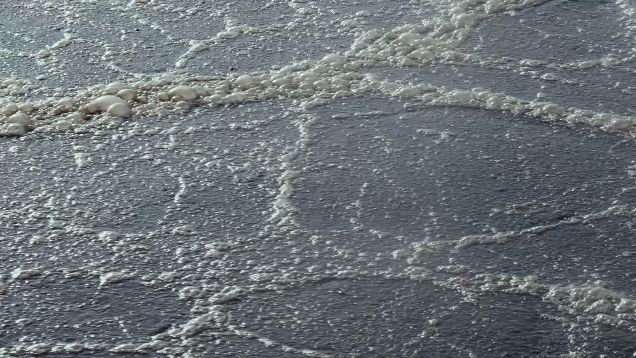 Close-up of boiling water in a wastewater basin, representing purification, industrial environment.