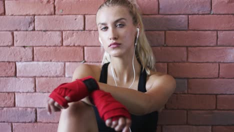 relaxed sportswoman listening to music