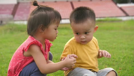 little girl help the boy get up