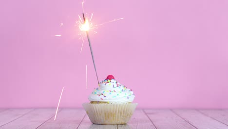 burning fire candle on testy sweet cup cake with white cream
