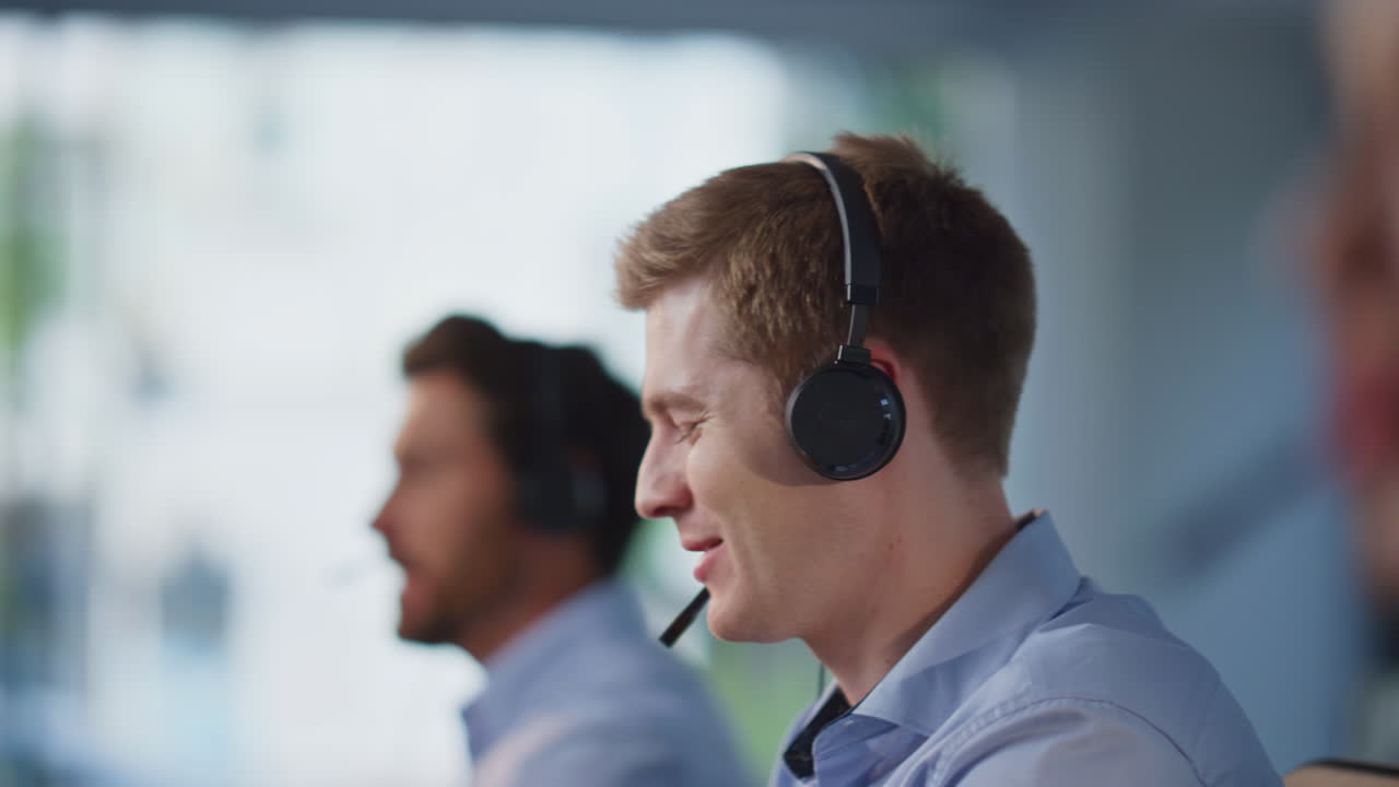 Group telemarketing managers talking in headphones sitting office space closeup