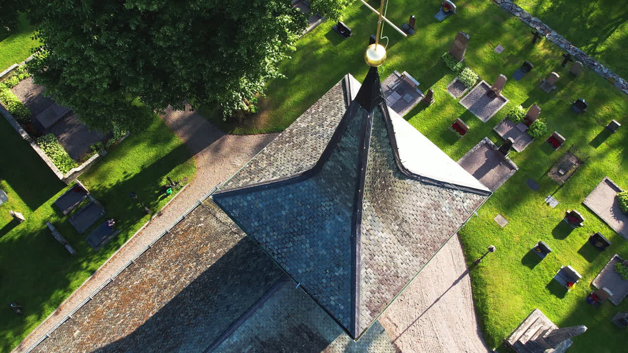 Aerial drone shot of Skalleruds Church with graves in the day in West Sweden
