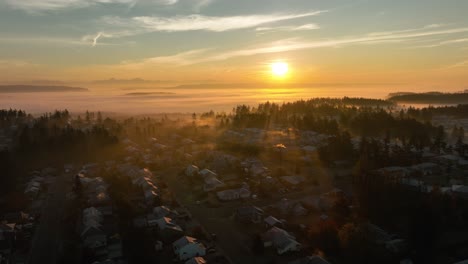 wide aerial view of a whidbey island neighborhood underneath a foggy sunrise