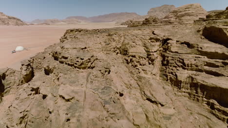 towering granite mountains revealed bubble camp tents in wadi rum, jordan