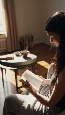 woman reading in a sunny living room