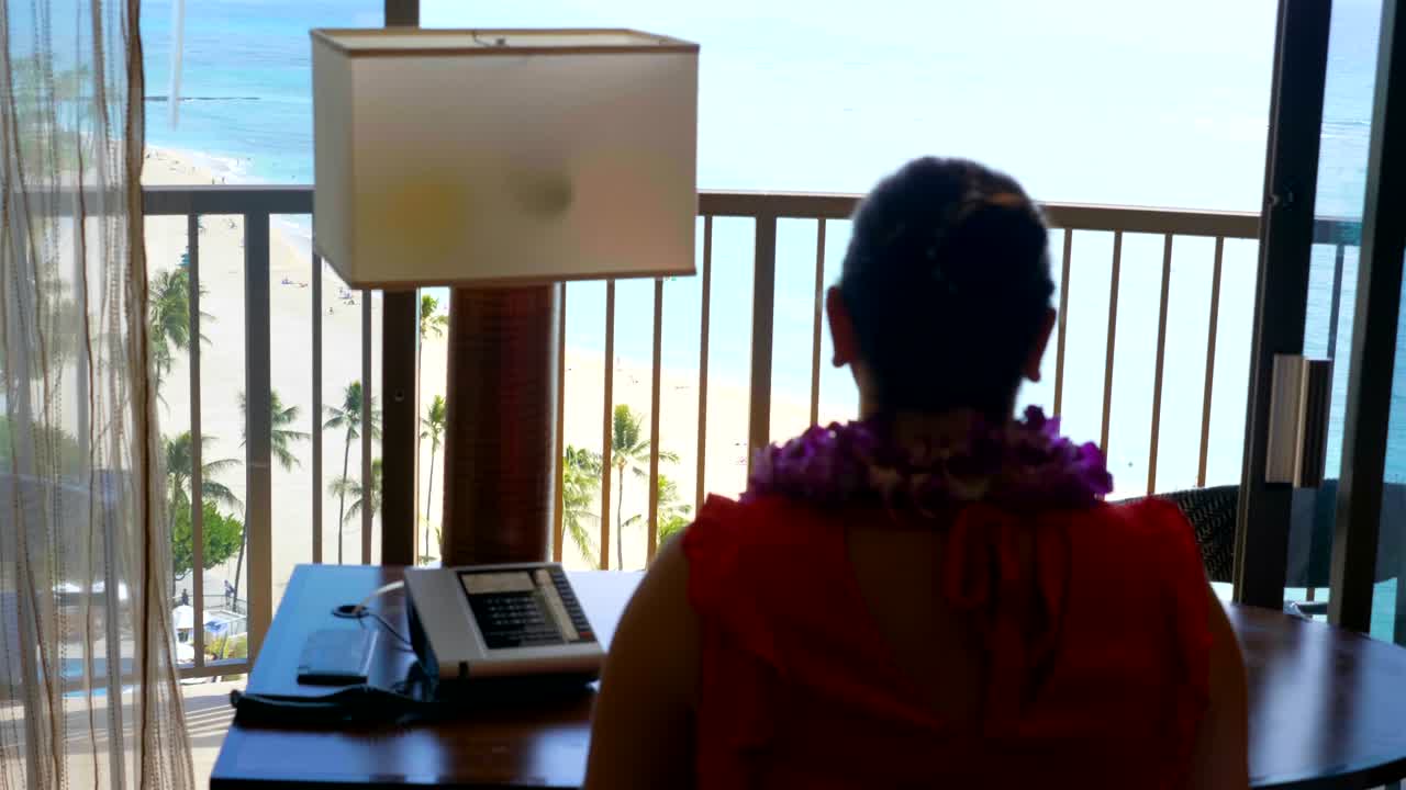 Freelancer working in paradise office in 4k slow motion