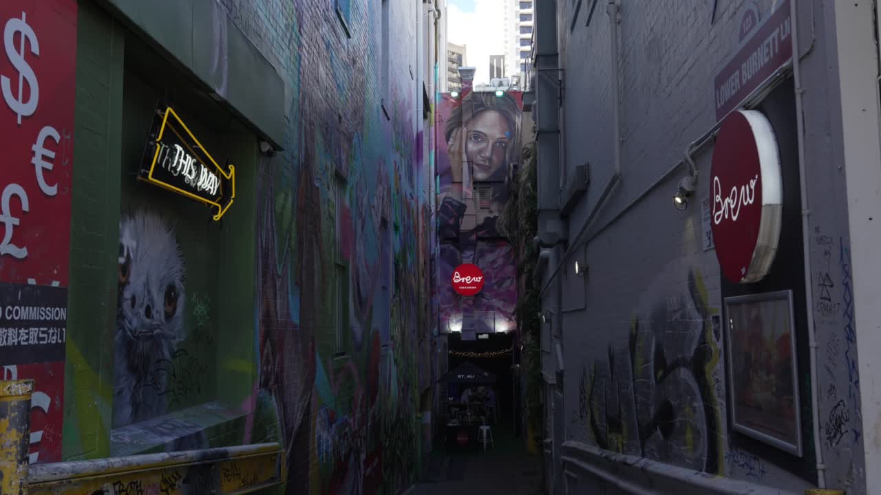 Graffiti art street decorated back alley in Brisbane Australia, this way sign