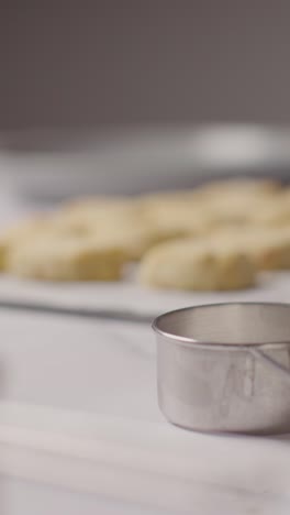 Vertical-Video-Of-Tray-Of-Homemade-Shortbread-Cookies-On-Kitchen-Work-Surface-With-Ingredients