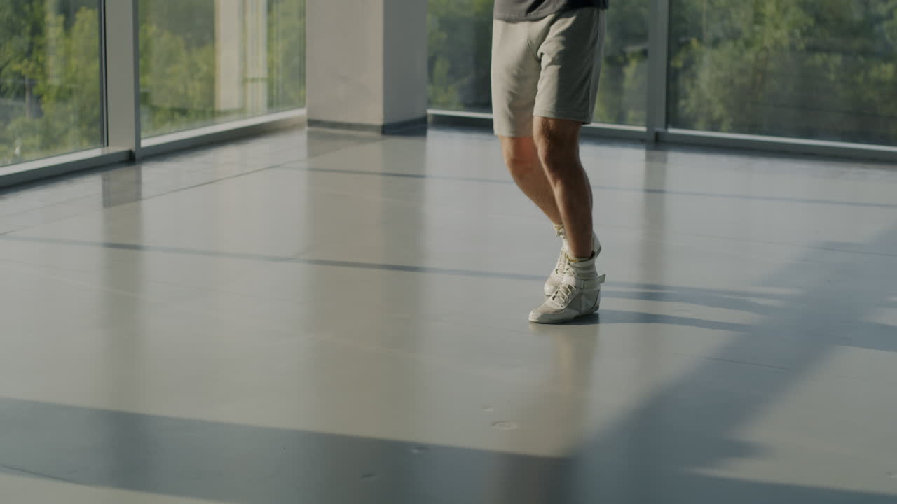 Man Jumping Rope in a Modern Gym