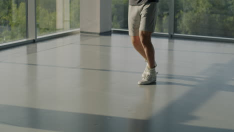 man jumping rope in a modern gym