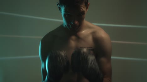 determined boxer with boxing gloves ready to fight