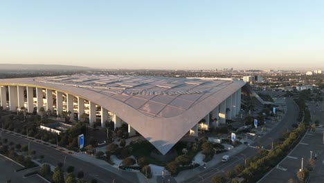 sofi stadium aerial shot during sunrise with empty parking lot