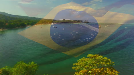 animation of flag of brazil blowing over okay hands on beach landscape