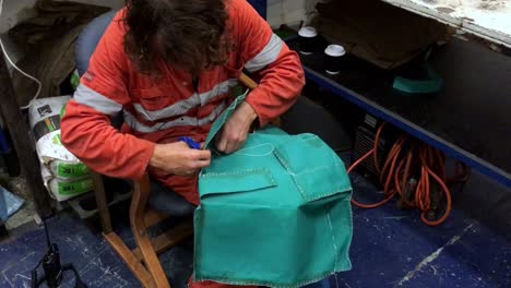hand-held footage of a sailor in high-visibility clothing