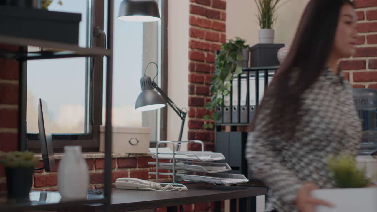 Woman getting fired and packing up belongings