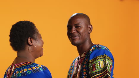 African-american-man-kissing-his-wife-forehead-on-camera