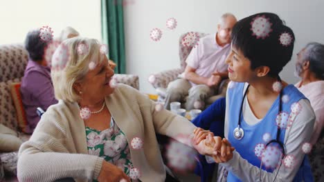 animation of coronavirus covid-19 cells spreading over senior caucasian woman and medical worker