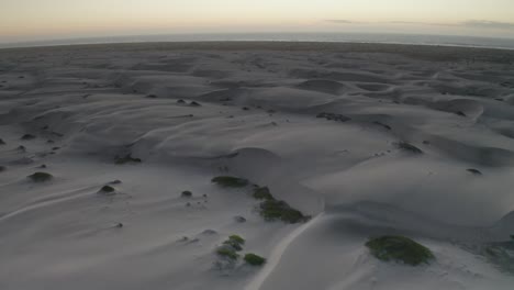 aerial flight over sand dune desert landscape of baja california sur, mexico