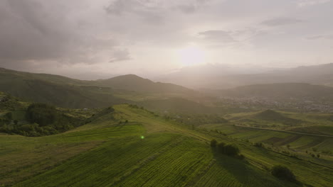 Warm-Sun-On-Cloudy-Sky-At-Dusk-Over-Lush-Green-Hills-In-Akhaltsikhe,-Georgia