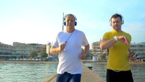 man checking smart watch during morning jogging