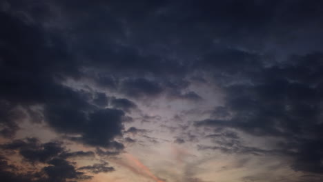 Time-Lapse-of-Clouds-Passing-By-at-Sunset