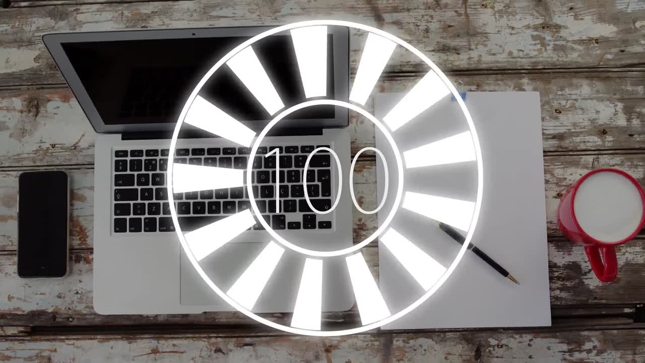 노트북과 스마트폰 위에서 회전하는 로딩  ⁇ 의 애니메이션