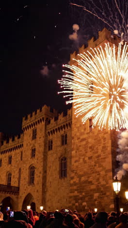 fireworks over a historic castle at night