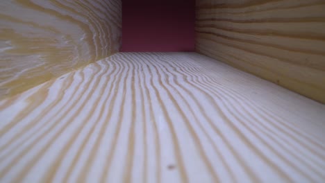 close-up view of light-colored wooden beams/planks