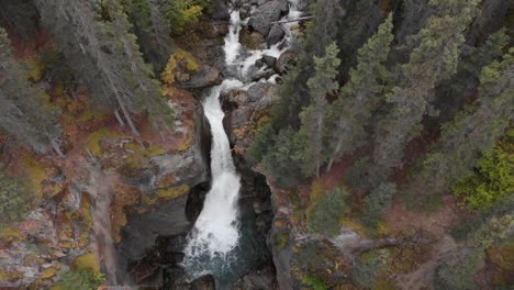 Waterfall-Cascading-Over-Rocky-Mountain-Slope-In-Temperate-Rainforest-At-Alaska,-USA