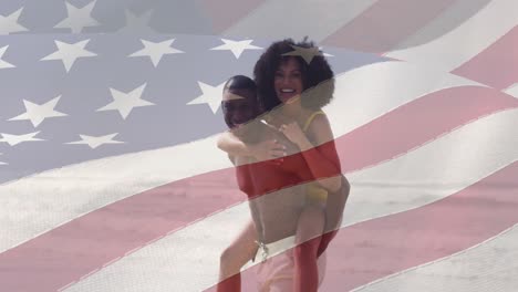 animation of flag of usa over happy african american couple in love on beach