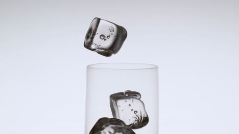 Five-Ice-Cubes-Dropping-into-a-Glass-in-Studio