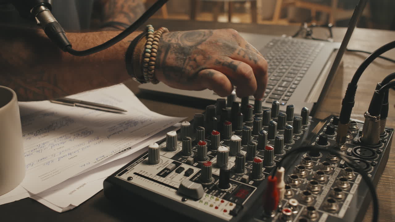 Unrecognizable Podcast Host Using Audio Mixer