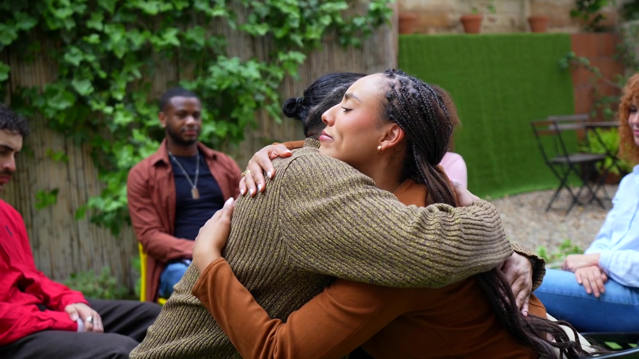 Diverse Group of People Supporting Each Other in a Therapy Circle