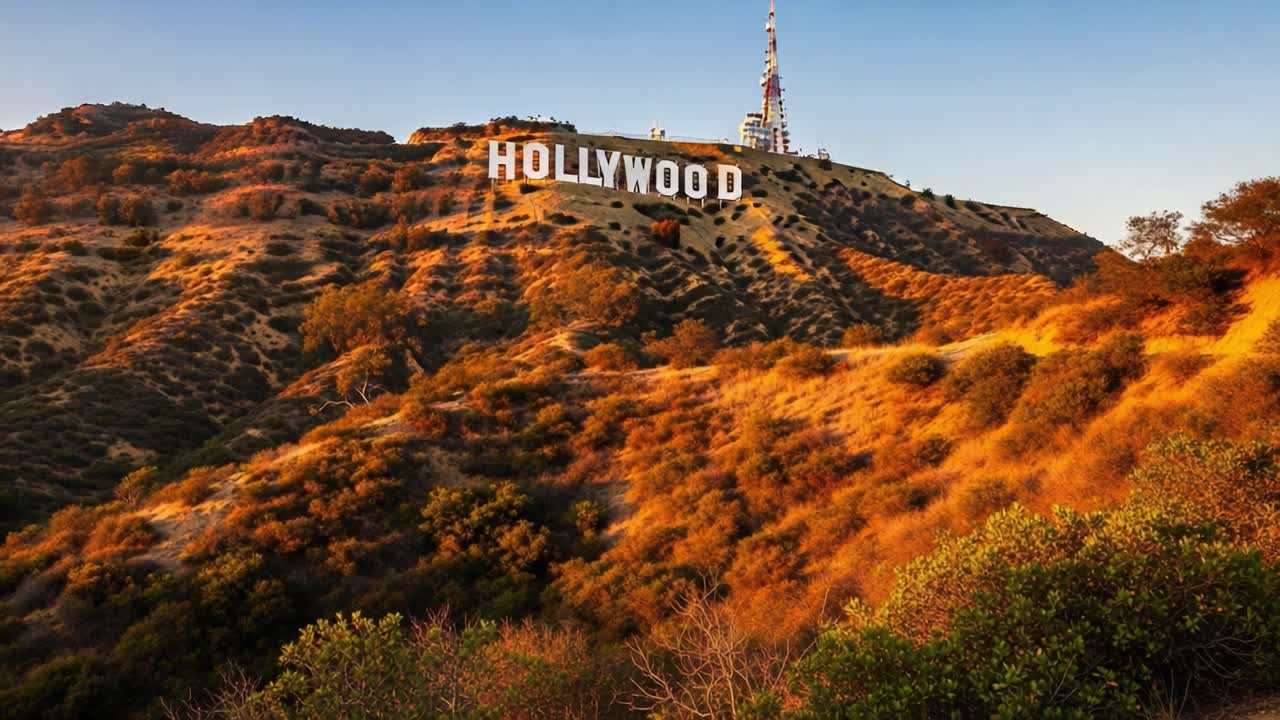 Breathtaking View of the Iconic Hollywood Sign Surrounded by Scenic Hills and Golden Sunset Light, Capturing the Essence of Los Angeles's Cultural Landmark