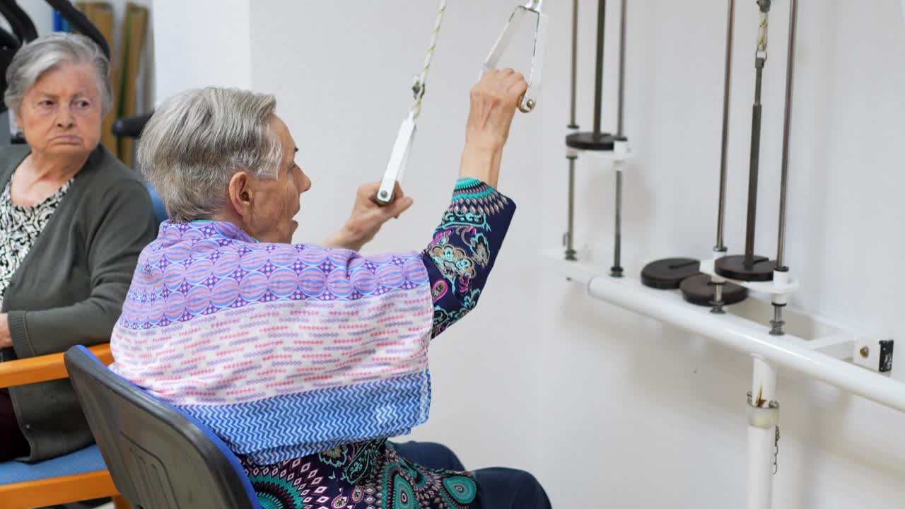 Elderly People Exercising in Rehabilitation Center