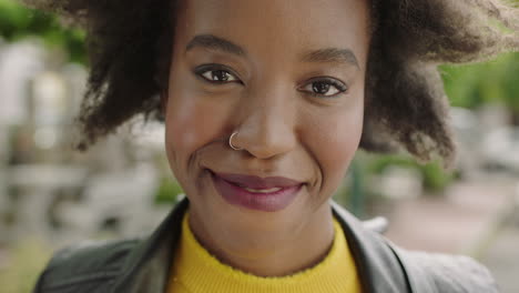 close-up-portrait-of-beautiful-trendy-african-american-woman-student-looking-at-camera-laughing-cheerful-enjoying-successful-lifestyle