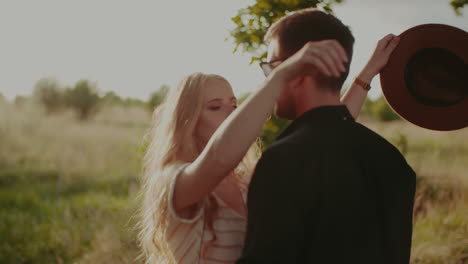 Positive-Woman-Supporting-Young-Man-Outdoors-At-Sunset