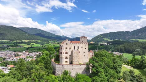 drone fly bruneck castle italian landmark around green alpine landscape overlooking the town of brunico in the pusteria valley