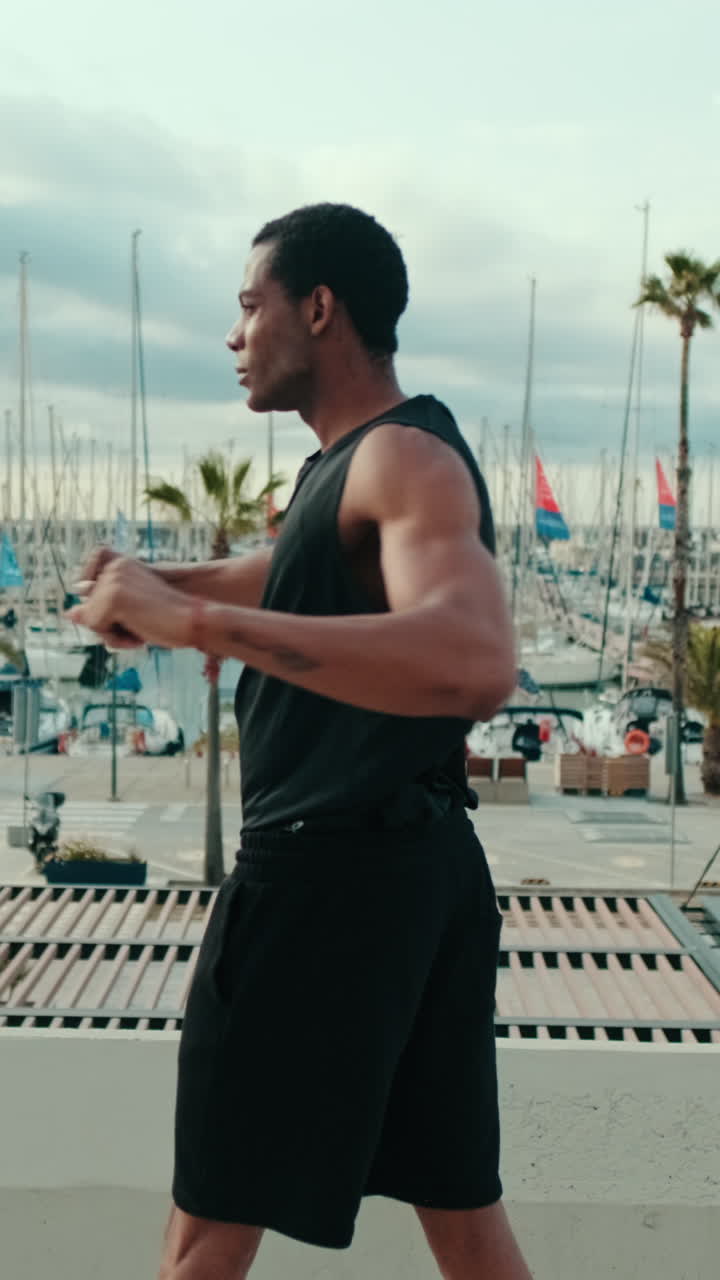 Muscular Black Man Overlooking Marina
