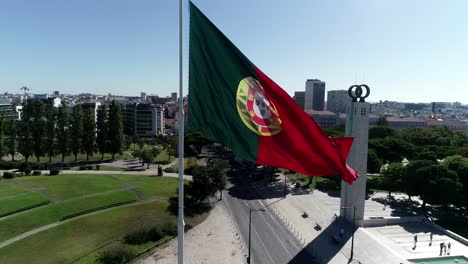 giant portugal flag winding in portuguese city capital