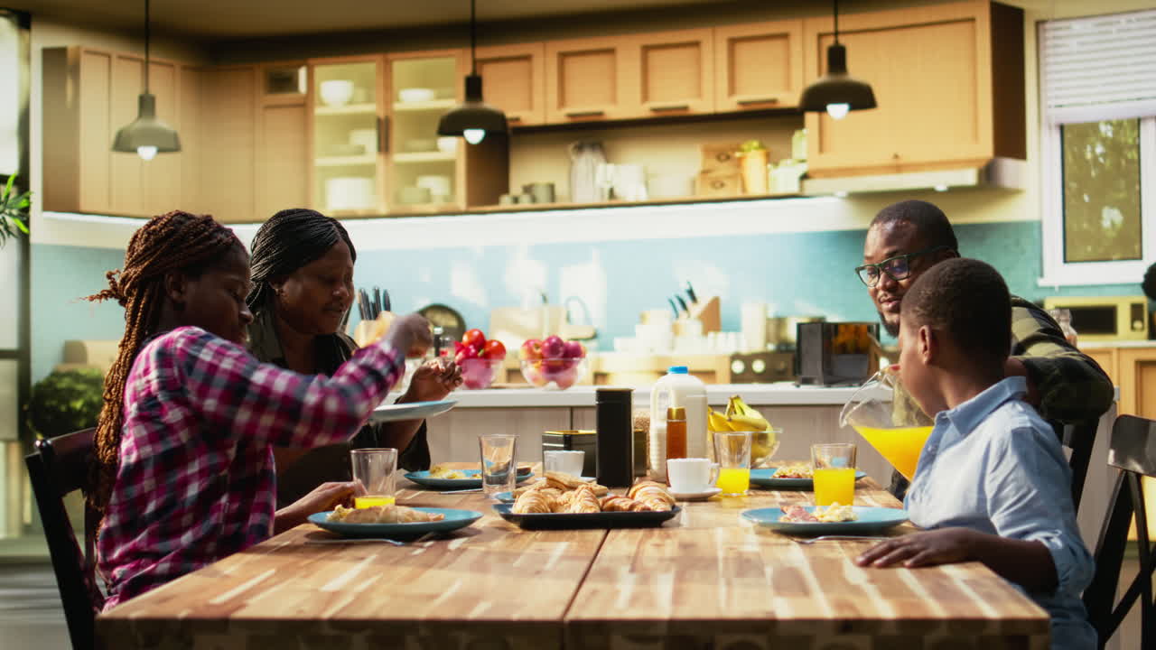 Family enjoying breakfast together at home