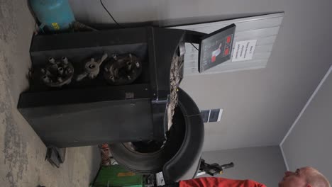 tire balancing machine in a garage