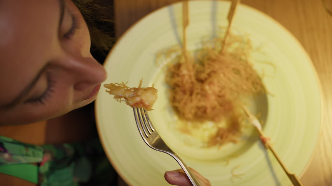 Woman Having Sophisticated Shrimp Dish For Dinner At The Restaurant