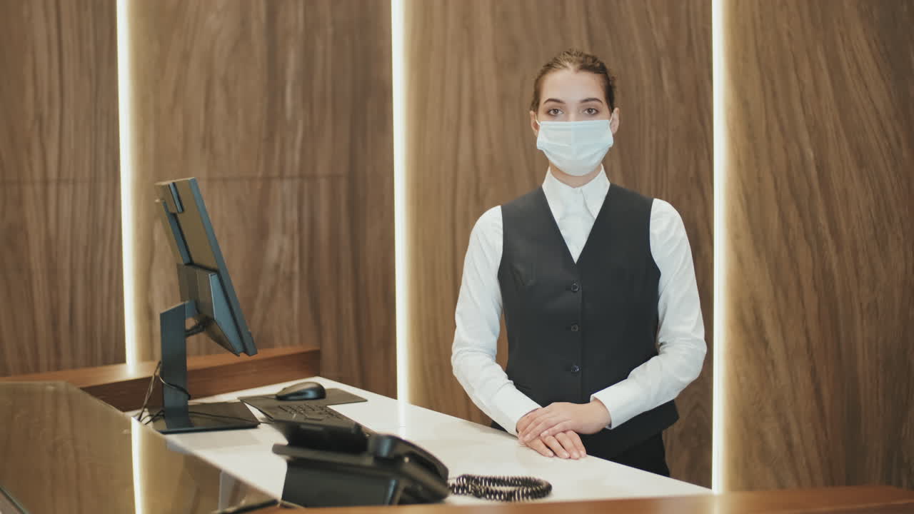 Female Receptionist in Face Mask at Workplace