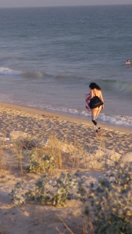 woman with prosthetic legs on the beach