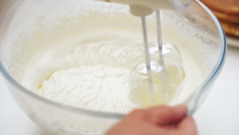 close-up of a mixer whipping a batter