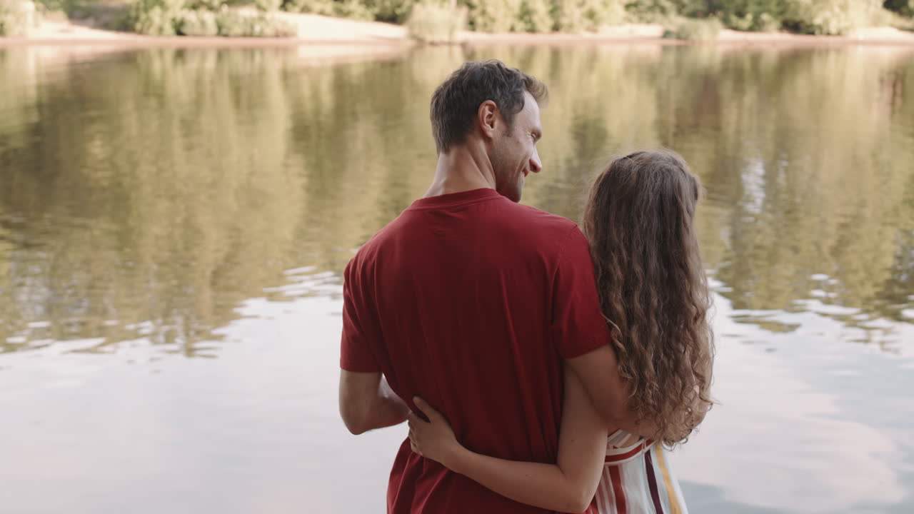 Couple Hugging by Lake Shore