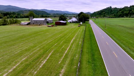 car passes by old farmhouse near mountain city tennessee in appalachia